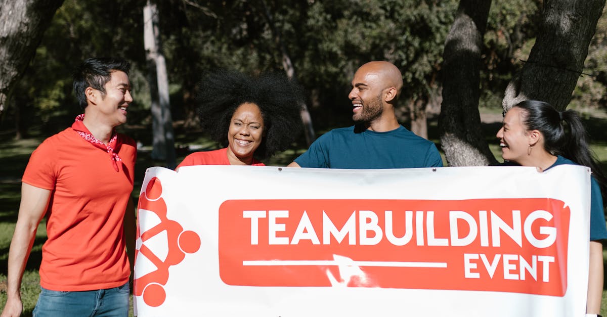 A joyful group of diverse adults at a teambuilding event in a park.